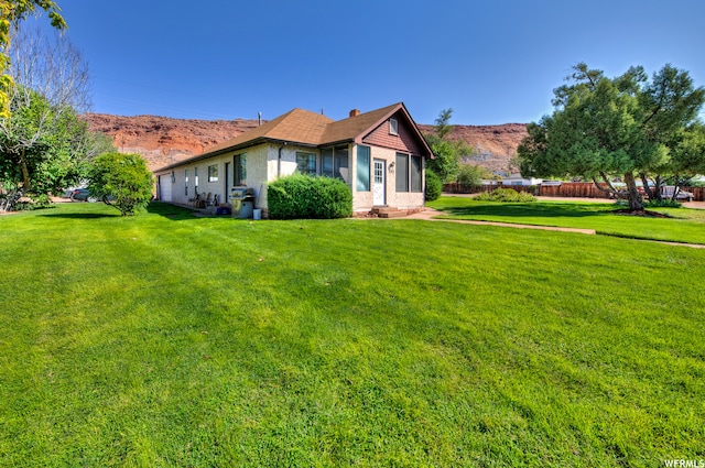 195 E 200 N, Moab, UT 84532 - view of property exterior featuring a mountain view and a chimney