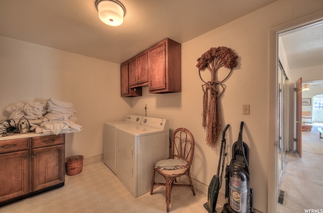 195 E 200 N, Moab, UT 84532 - washroom with washing machine and dryer, cabinet space, and light flooring
