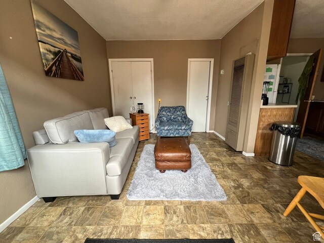 195 E 200 N, Moab, UT 84532 - living room with stone finish floors and a heating unit