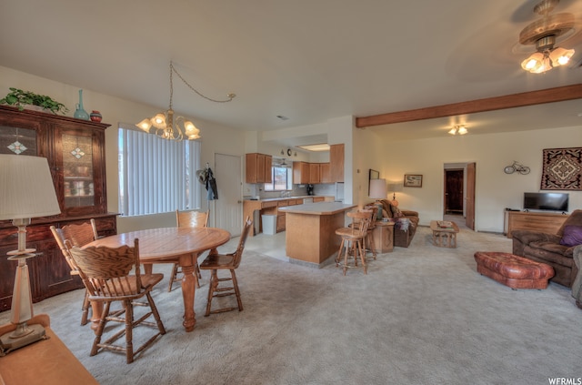 195 E 200 N, Moab, UT 84532 - dining space with light colored carpet, beam ceiling, and a chandelier