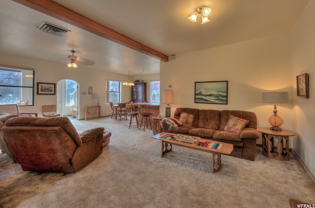 195 E 200 N, Moab, UT 84532 - living area featuring carpet, plenty of natural light, a chandelier, beamed ceiling, and ceiling fan