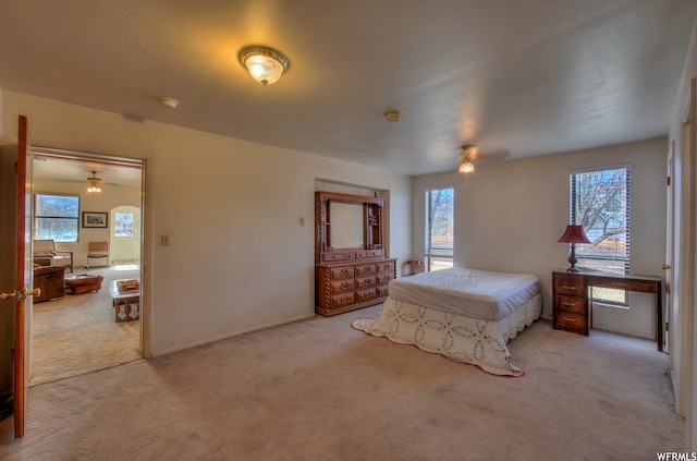 195 E 200 N, Moab, UT 84532 - carpeted bedroom featuring multiple windows and ceiling fan