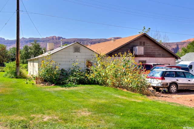 195 E 200 N, Moab, UT 84532 - view of front of property with a mountain view and a front lawn