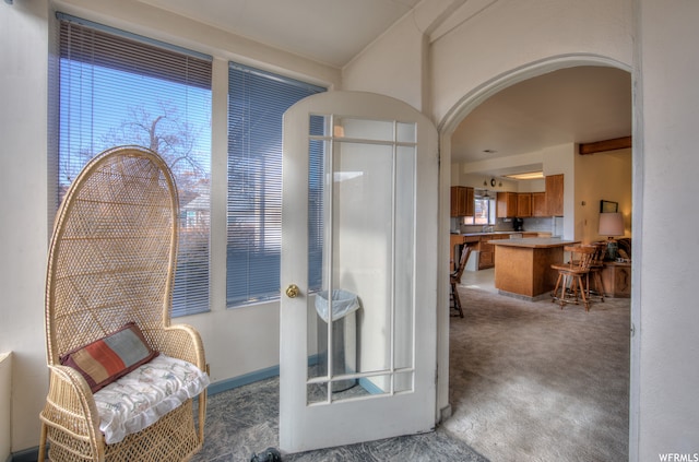 195 E 200 N, Moab, UT 84532 - living area featuring arched walkways and carpet