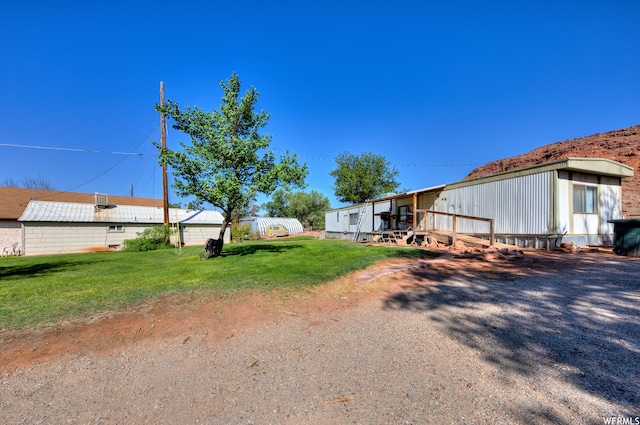 195 E 200 N, Moab, UT 84532 - view of green lawn with a deck