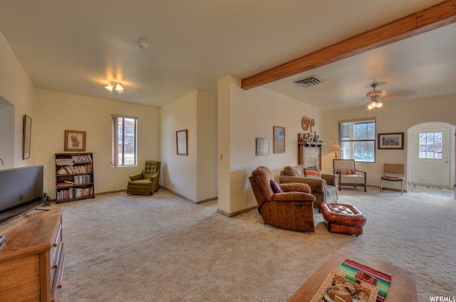 195 E 200 N, Moab, UT 84532 - living room with light carpet, ceiling fan, and beam ceiling