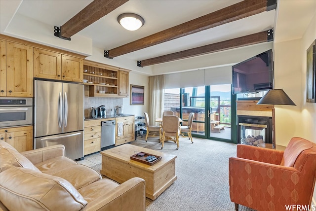1456 Newpark Blvd Unit 422, Park City, UT 84098 - living room with sink, light colored carpet, beamed ceiling, and a multi sided fireplace