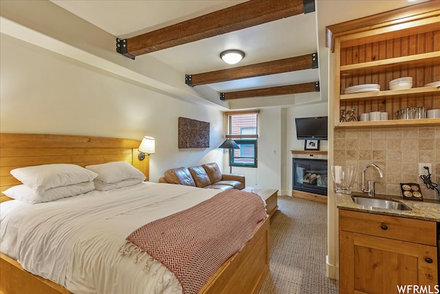 1456 Newpark Blvd Unit 422, Park City, UT 84098 - bedroom with beam ceiling, sink, and dark carpet