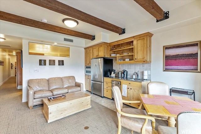 1456 Newpark Blvd Unit 422, Park City, UT 84098 - kitchen featuring beamed ceiling, light colored carpet, stainless steel fridge, backsplash, and sink