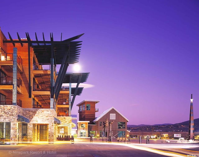 view of outdoor building at dusk