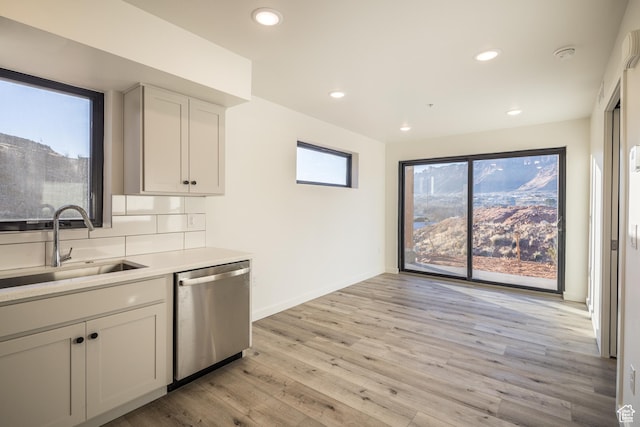 1185 S Murphy Ln Unit 402B, Moab, UT 84532 - kitchen featuring stainless steel dishwasher, a sink, light wood-style flooring, light countertops, and recessed lighting