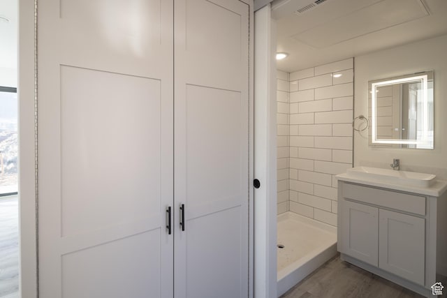 1185 S Murphy Ln Unit 402B, Moab, UT 84532 - bathroom with vanity, a stall shower, and wood finished floors