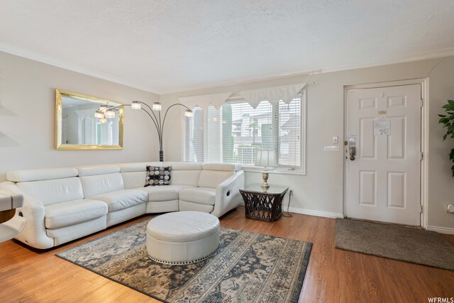 1845 W Canyon Dr Unit 304, St George, UT 84770 - living room featuring crown molding and light wood-type flooring