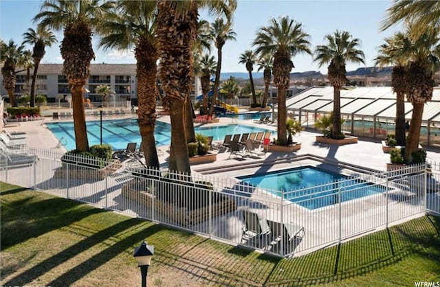 1845 W Canyon Dr Unit 304, St George, UT 84770 - view of swimming pool with a yard, a community hot tub, and a patio