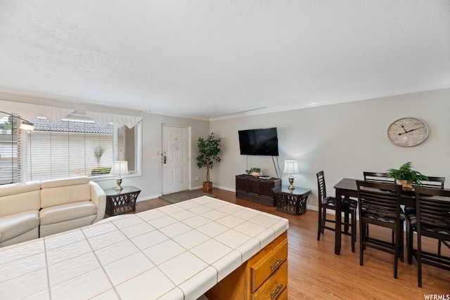 1845 W Canyon Dr Unit 304, St George, UT 84770 - kitchen featuring tile countertops and light hardwood / wood-style flooring