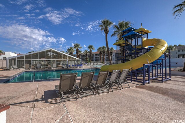 1845 W Canyon Dr Unit 304, St George, UT 84770 - view of pool featuring a water slide, a playground, and a patio area