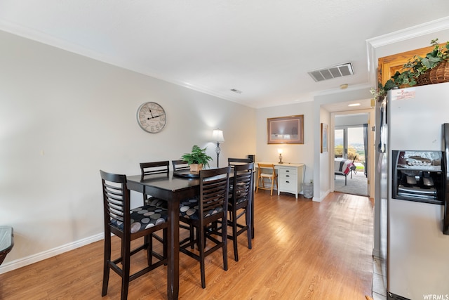 1845 W Canyon Dr Unit 304, St George, UT 84770 - dining space with ornamental molding and light wood-type flooring