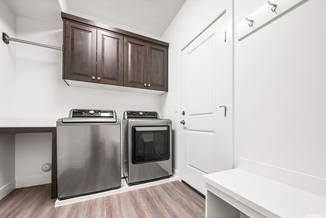 1960 W Jaydin Way Unit 2, West Haven, UT 84401 - laundry area featuring cabinets, light wood-type flooring, and washer and clothes dryer