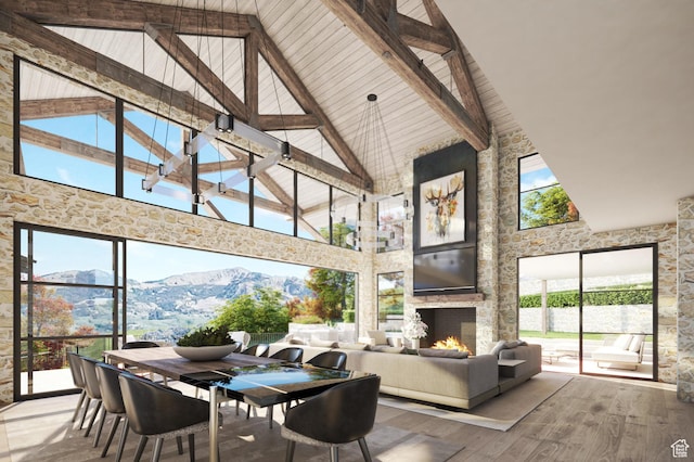8139 N Sunrise Loop, Park City, UT 84098 - sunroom with a stone fireplace, a mountain view, and lofted ceiling with beams