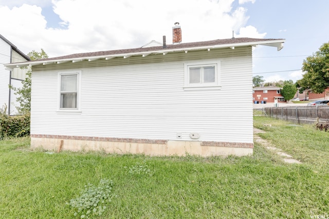 871 N 700 E, Logan, UT 84321 - view of side of home with a yard