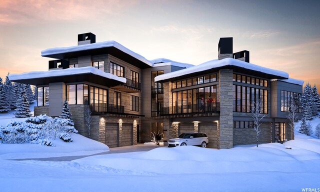 7932 Red Tail Ct, Park City, UT 84060 - snow covered house with a garage