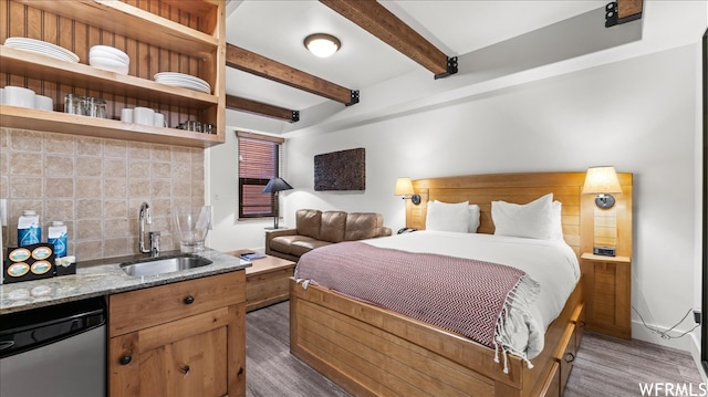 1476 Newpark Blvd Unit 204, Park City, UT 84098 - bedroom with beam ceiling, dark wood-type flooring, and sink