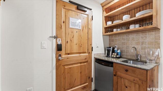 1476 Newpark Blvd Unit 204, Park City, UT 84098 - kitchen featuring dark stone countertops, backsplash, dishwasher, and sink