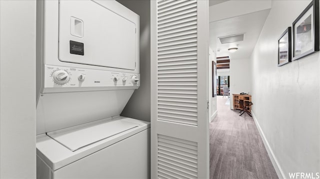 1476 Newpark Blvd Unit 204, Park City, UT 84098 - laundry area with stacked washer and clothes dryer and light wood-type flooring
