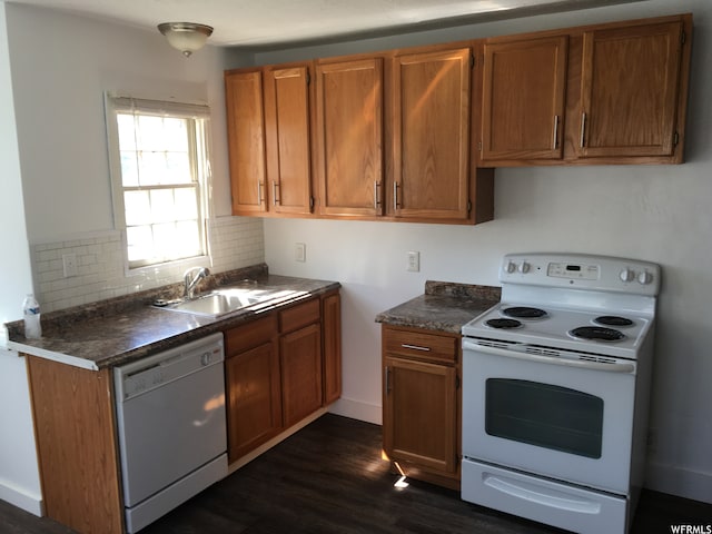 1703 N Main St, Sunset, UT 84015 - kitchen featuring backsplash, white appliances, dark hardwood / wood-style floors, and sink