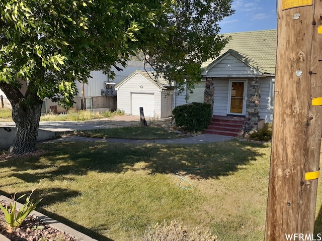 1703 N Main St, Sunset, UT 84015 - view of front of home featuring a front yard and a garage