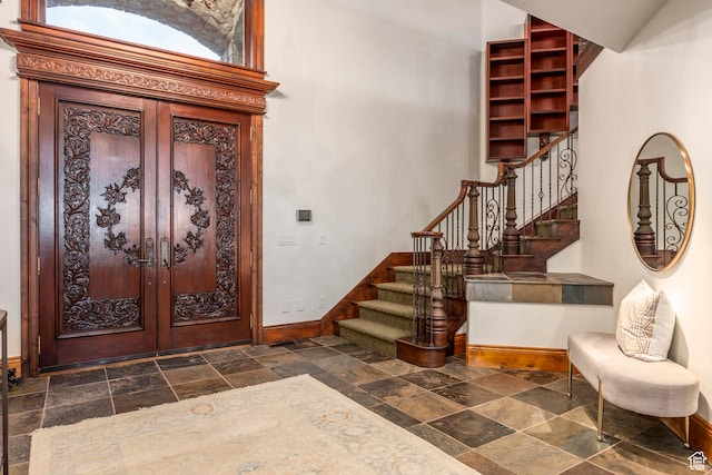 foyer entrance featuring french doors