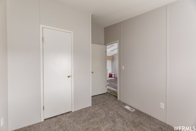 29665 N 9000 E, Fairview, UT 84629 - unfurnished bedroom with light carpet and a textured ceiling