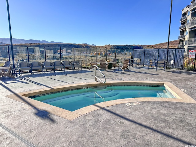 909 W Peace Tree Trl Unit 601, Heber City, UT 84032 - view of pool with a patio area, fence, and a mountain view