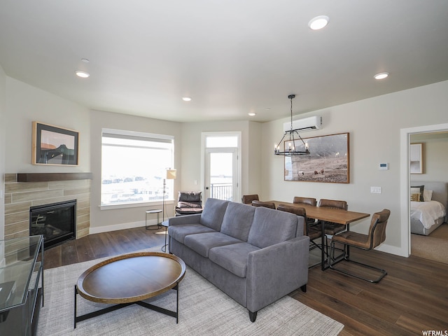 909 W Peace Tree Trl Unit 601, Heber City, UT 84032 - living room featuring recessed lighting, baseboards, a tiled fireplace, and wood finished floors