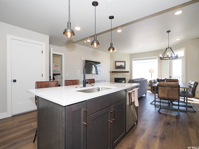 909 W Peace Tree Trl Unit 601, Heber City, UT 84032 - kitchen with dark wood-style flooring, light countertops, stainless steel dishwasher, a sink, and recessed lighting