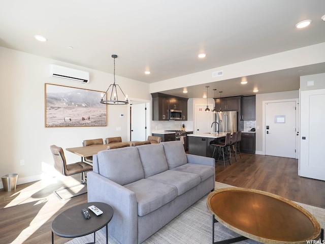 909 W Peace Tree Trl Unit 601, Heber City, UT 84032 - living room featuring dark wood-style floors, recessed lighting, an AC wall unit, and visible vents