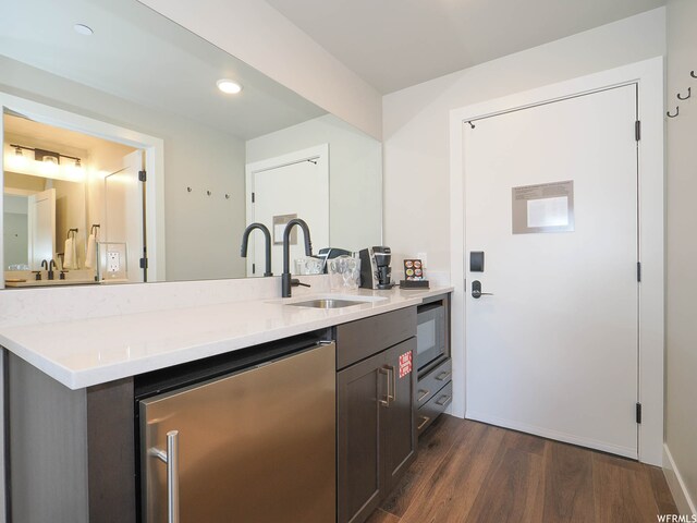 909 W Peace Tree Trl Unit 601, Heber City, UT 84032 - kitchen with dark wood-style floors, light countertops, a sink, and dishwasher