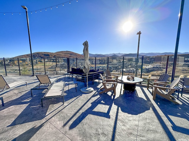 909 W Peace Tree Trl Unit 601, Heber City, UT 84032 - view of patio / terrace with an outdoor fire pit and a mountain view