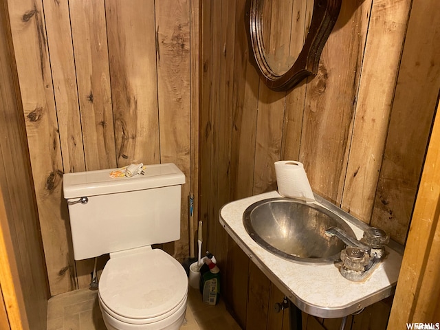 333 W Railroad Ave, Price, UT 84501 - bathroom featuring sink, wooden walls, and toilet