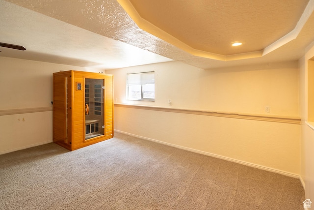 49 E 400 S, Monticello, UT 84535 - basement featuring a textured ceiling, carpet floors, baseboards, and a ceiling fan