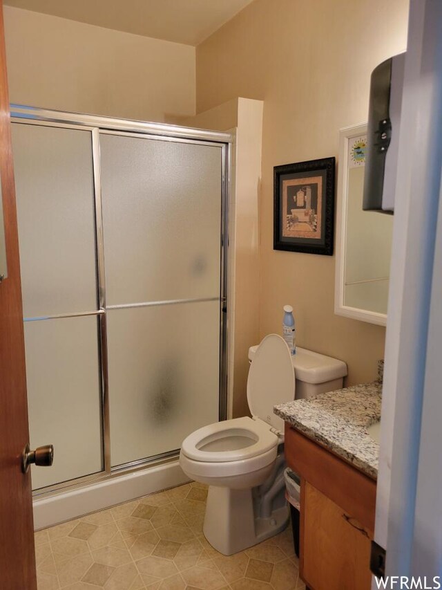 506 E Main St, Midway, UT 84049 - bathroom featuring a stall shower, toilet, and vanity