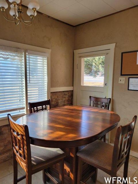 506 E Main St, Midway, UT 84049 - dining space featuring a chandelier, light tile patterned floors, and ornamental molding