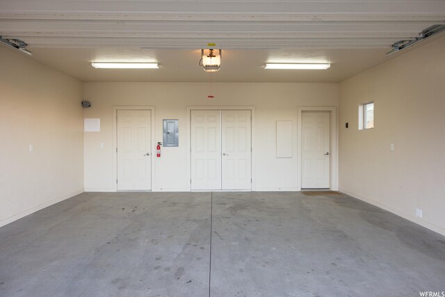 3862 Desert Willow Cir Unit 9-A1, Moab, UT 84532 - garage featuring electric panel and a garage door opener