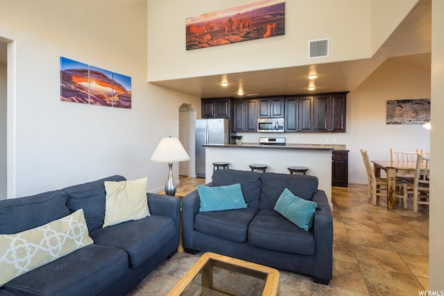 3862 Desert Willow Cir Unit 9-A1, Moab, UT 84532 - living room featuring a towering ceiling