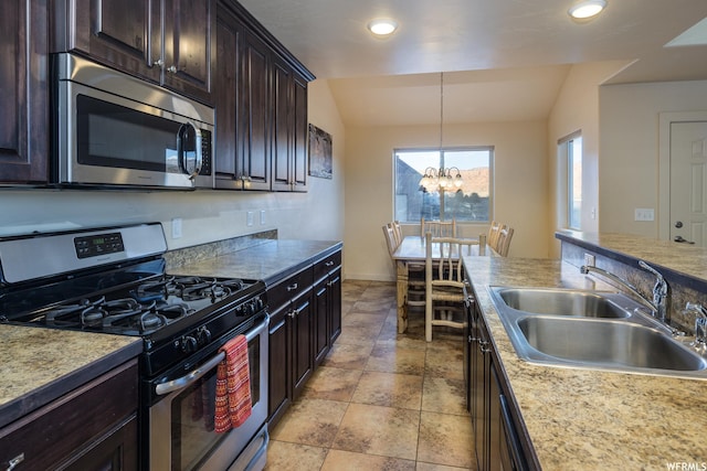 3862 Desert Willow Cir Unit 9-A1, Moab, UT 84532 - kitchen with sink, a notable chandelier, vaulted ceiling, dark brown cabinets, and appliances with stainless steel finishes