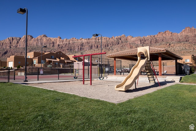 3862 Desert Willow Cir Unit 9-A1, Moab, UT 84532 - view of play area featuring a mountain view and a yard