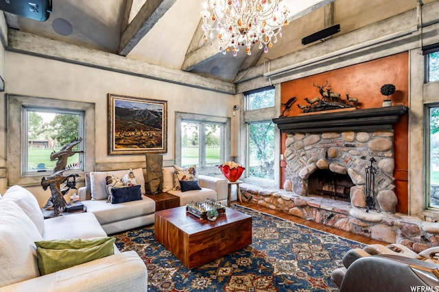 2085 W Midway Ln, Heber City, UT 84032 - living room featuring a high ceiling, a stone fireplace, a chandelier, and wood finished floors