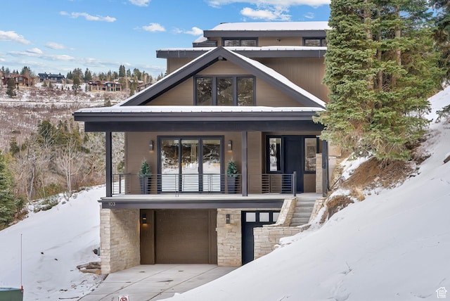 103 Alice Ct, Park City, UT 84060 - view of front facade with a porch, an attached garage, and stairway