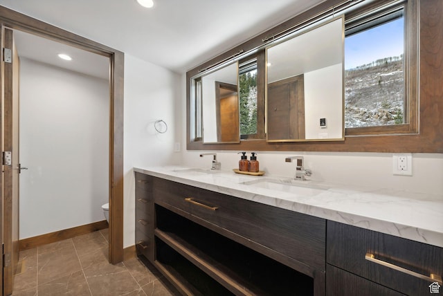 103 Alice Ct, Park City, UT 84060 - bathroom featuring toilet, double vanity, baseboards, recessed lighting, and tile patterned flooring