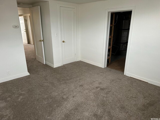 196 S Center St, American Fork, UT 84003 - unfurnished bedroom with baseboards, a closet, and carpet